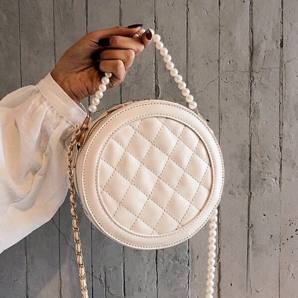 Bolso redondo pequeño tipo mensajero con cadena de perlas Lingge de estilo extranjero